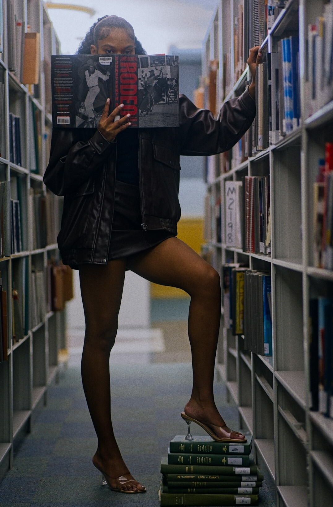 Old library shelves full of leather bound books