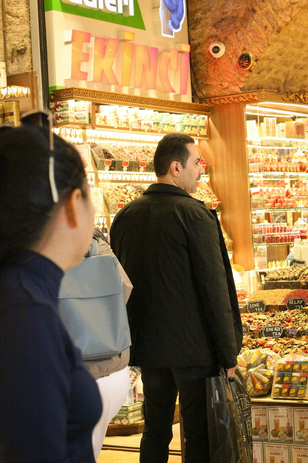 store detective observing shopper