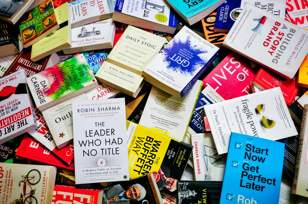Stack of old books on a wooden table