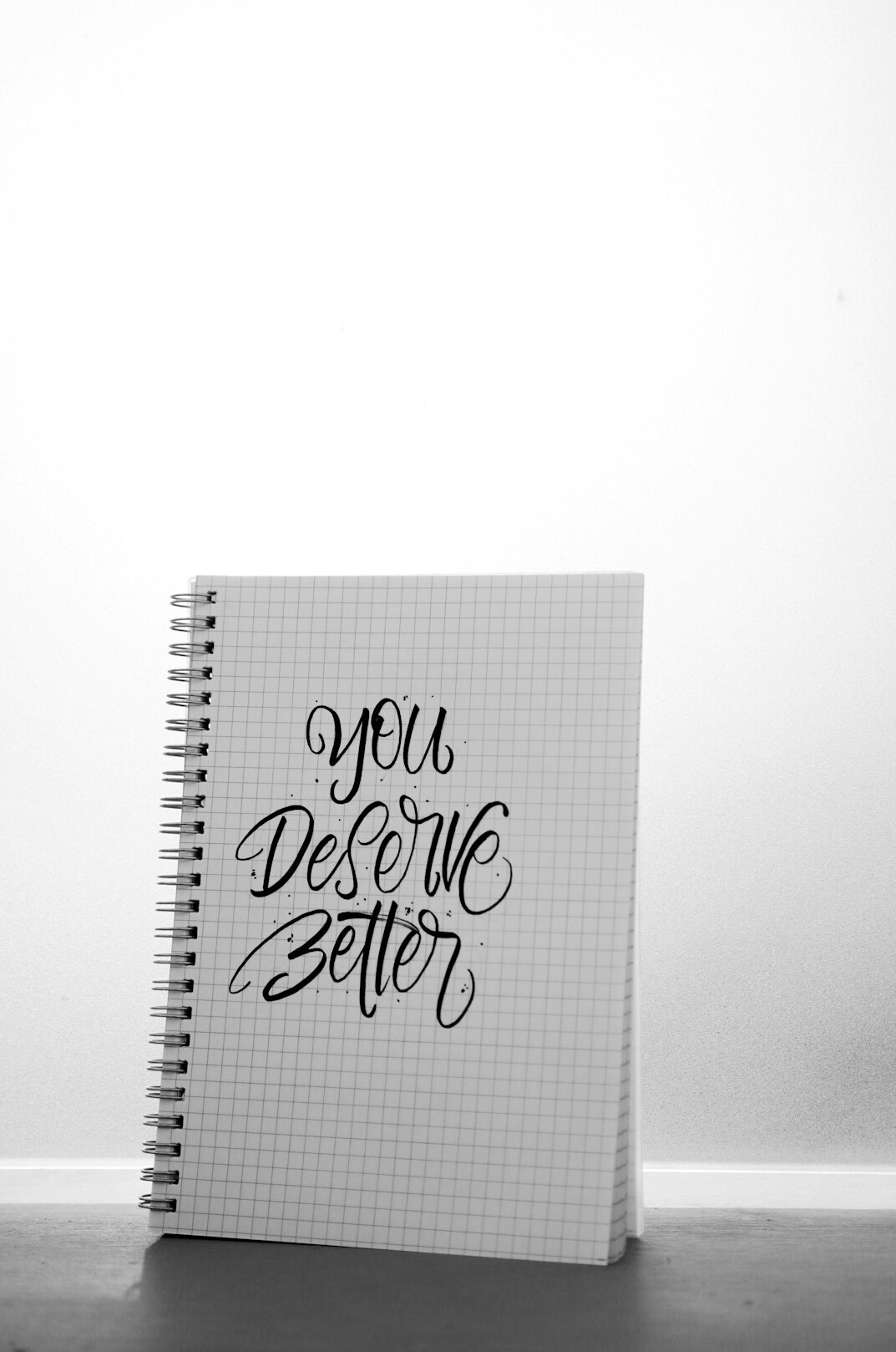 Notebook and pen on a desk for writing a story